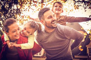 Happy family in autumn